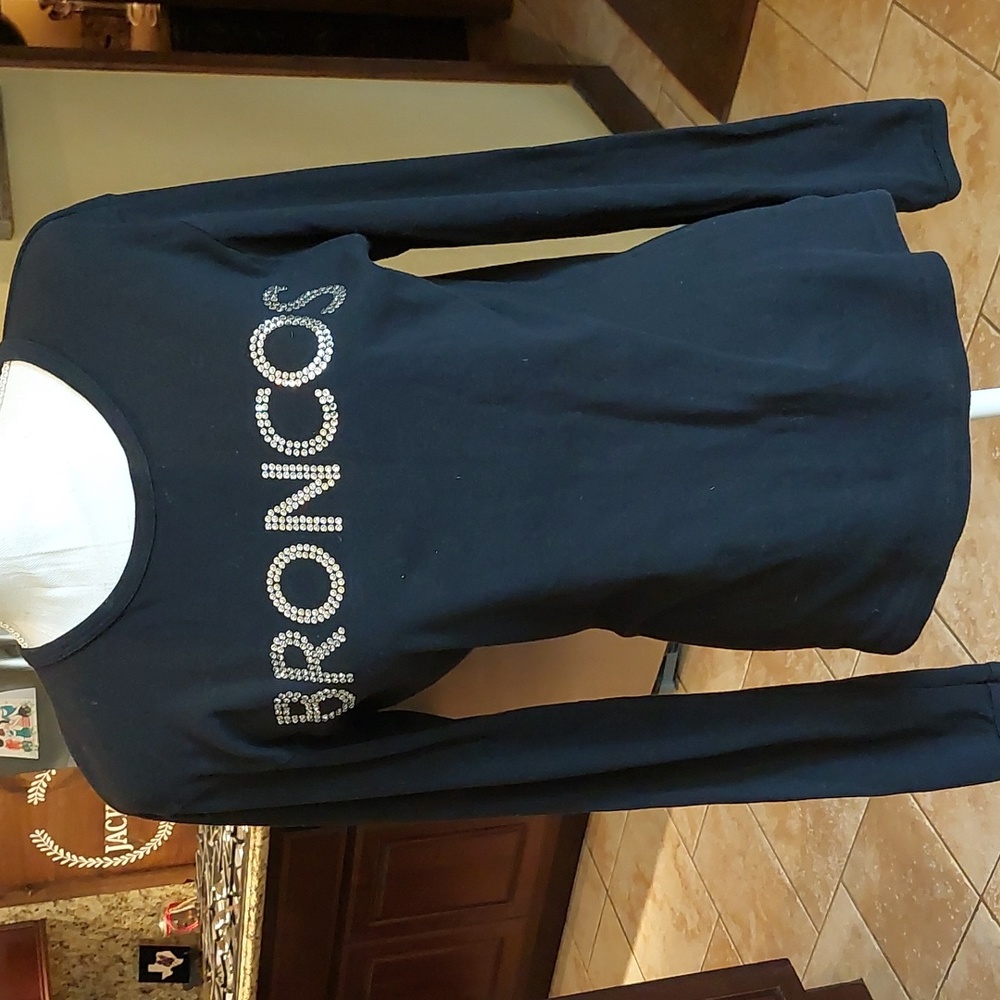 Broncos long sleeve bling t shirt. One of my favorites. Fits more like a large,